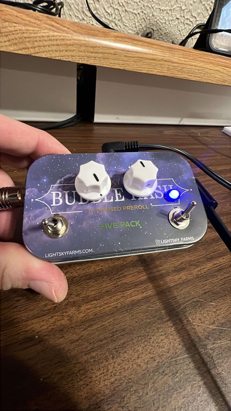 Finished dual-stage power boost pedal powered on with indicator LED lit