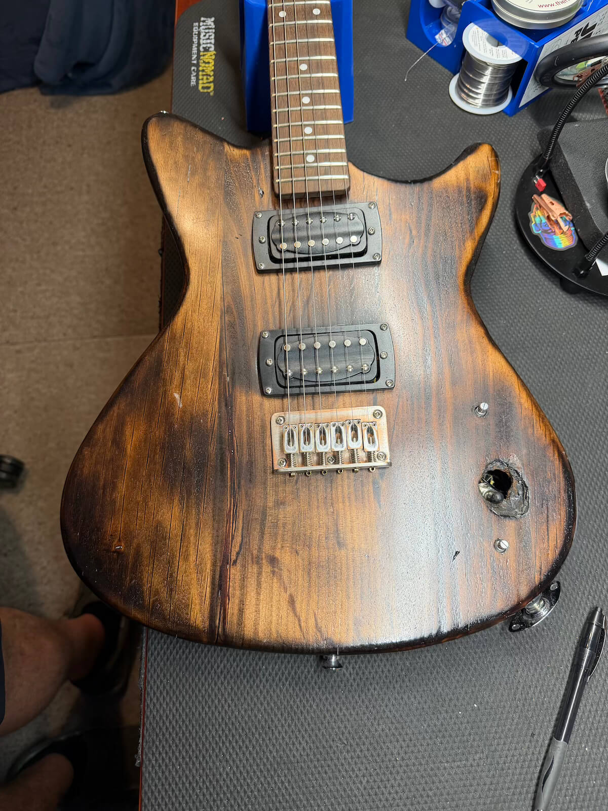 First Act guitar with damaged control area before the cavity was fully cut out