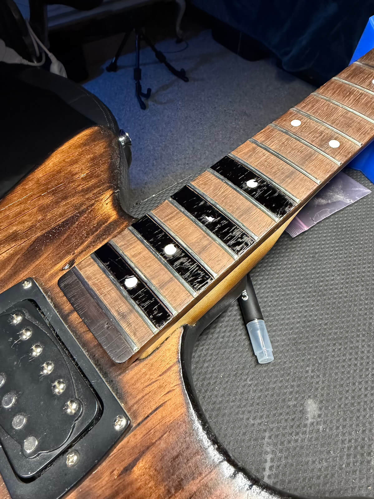 First Act fretboard during India ink dye process