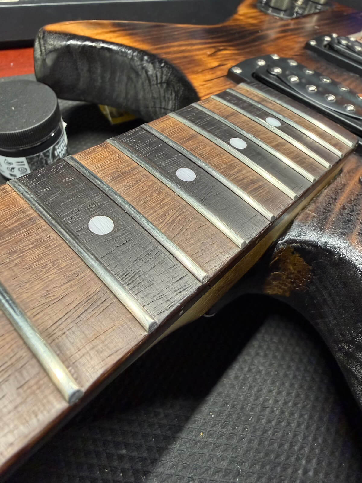 First Act fretboard after dye and fret-end work