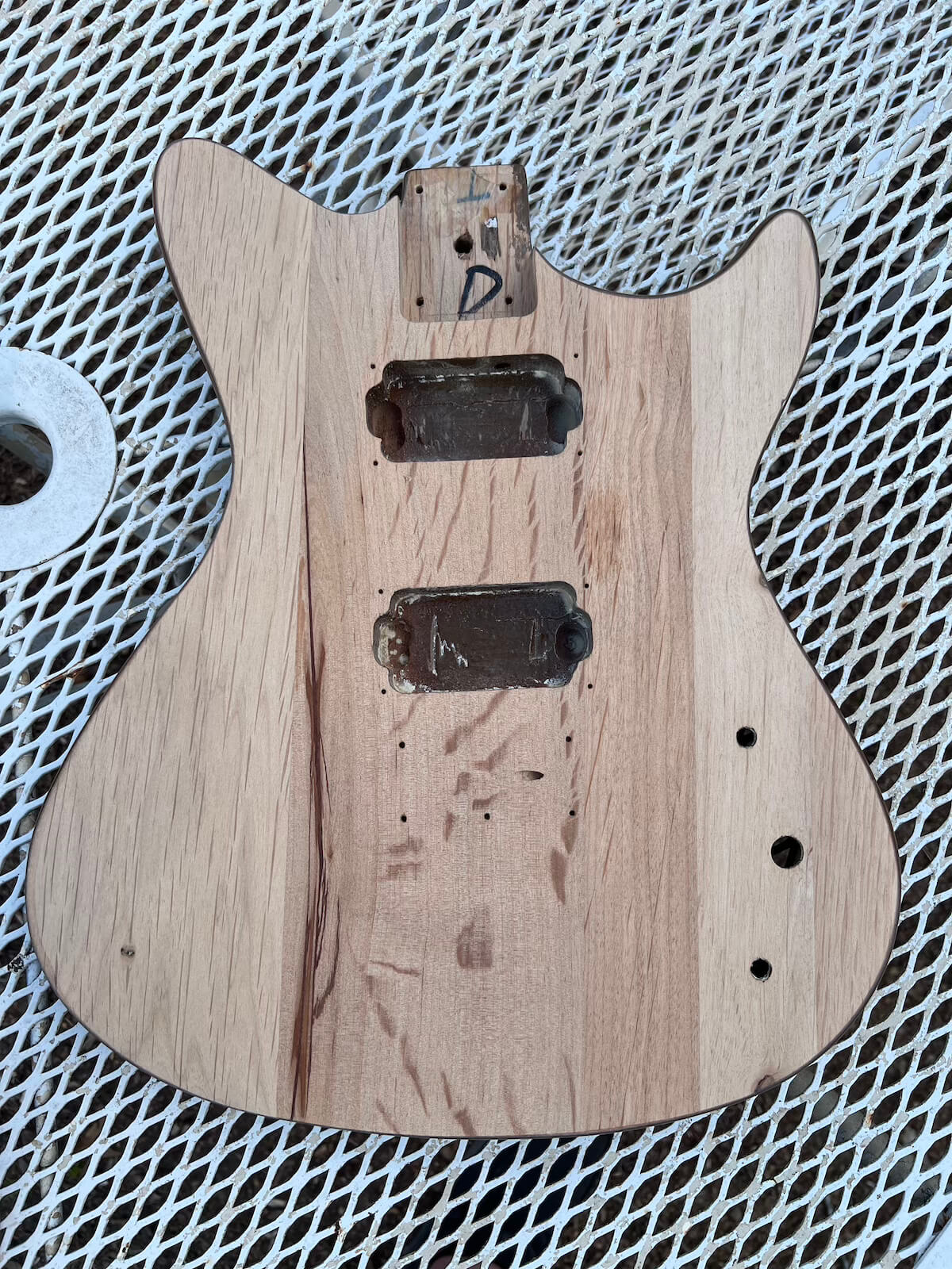First Act guitar body sanded down to bare wood