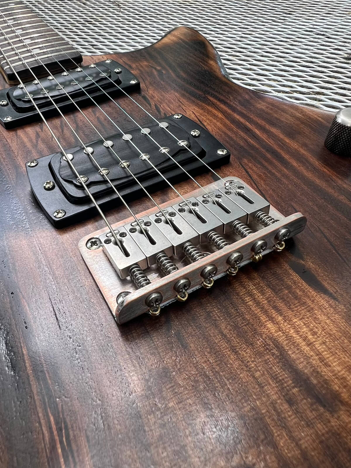Aged bridge hardware on the refinished First Act guitar