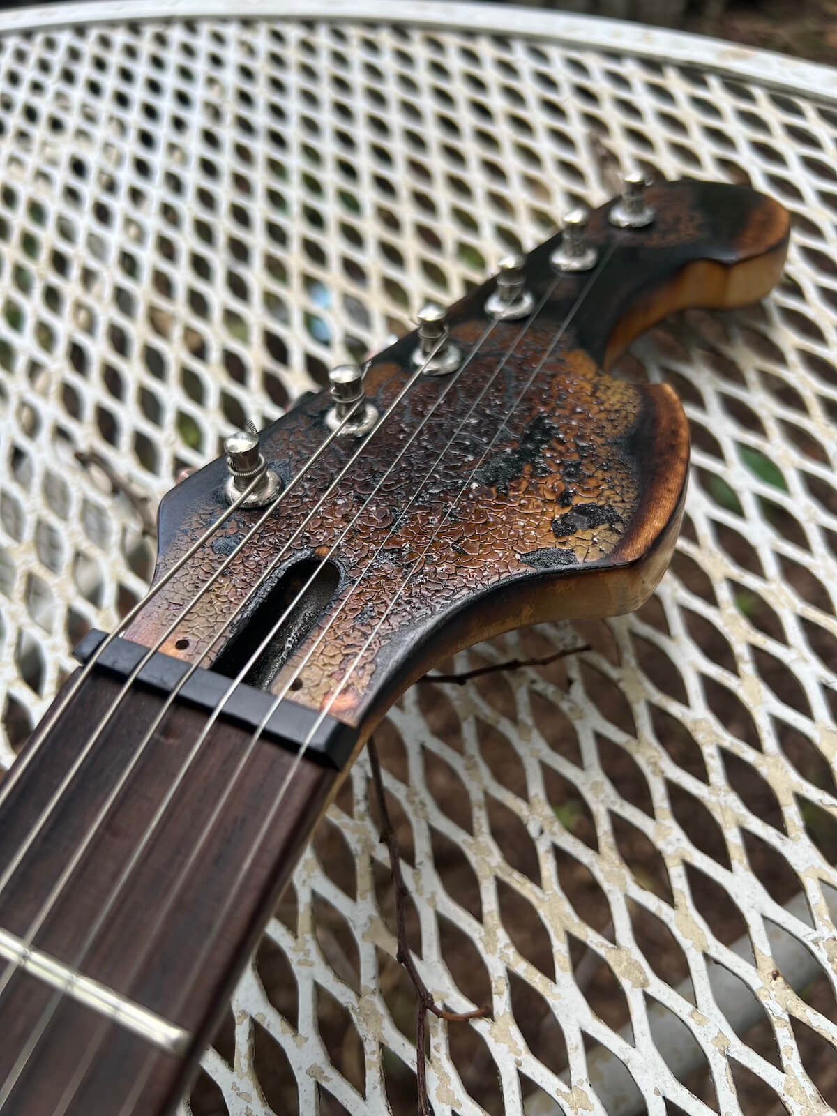 Burned and clear-coated First Act headstock