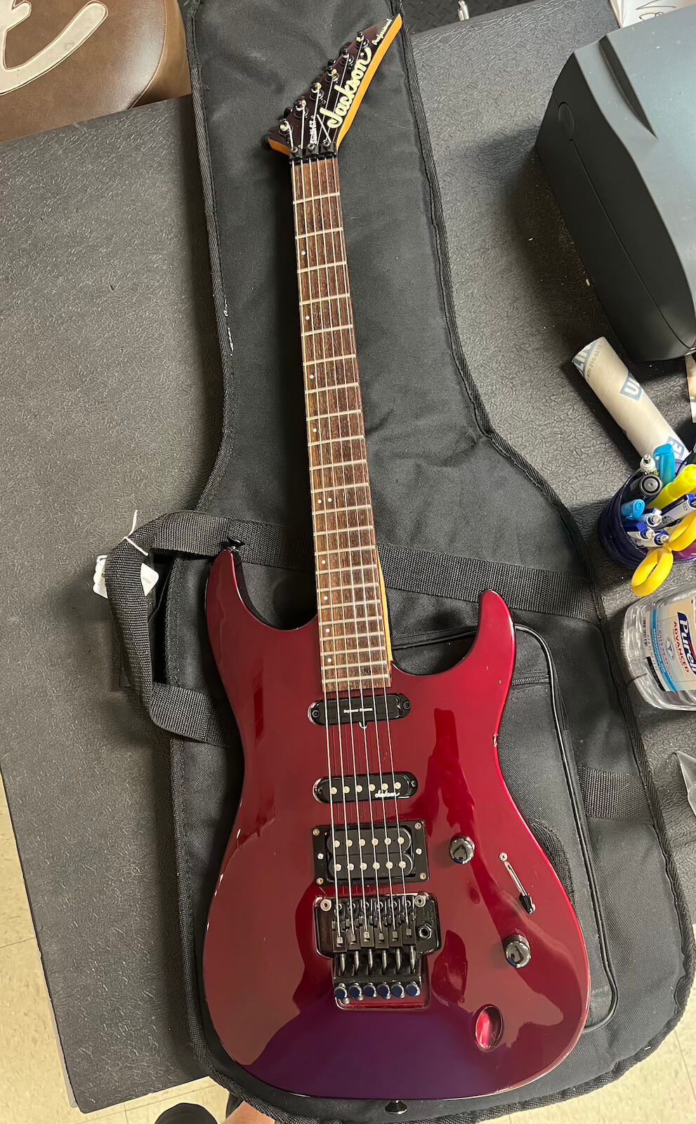 Full view of the modified red 1992 Jackson guitar