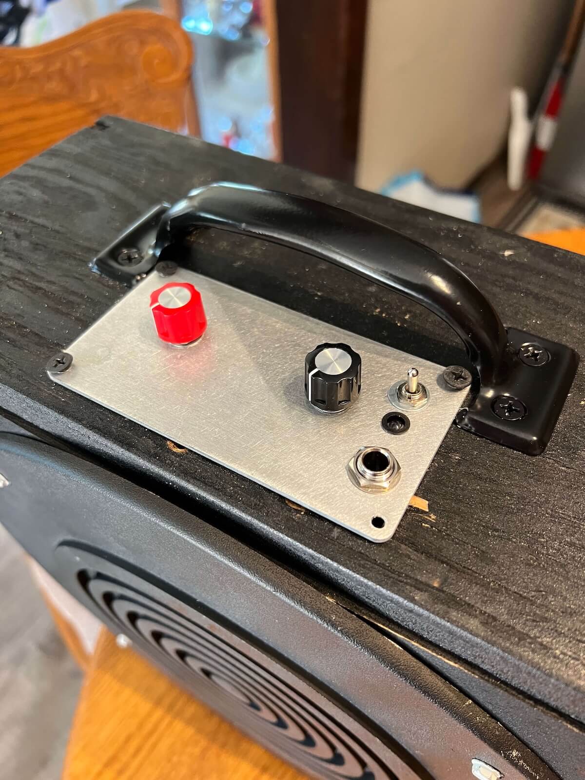 Compact LM386 practice amp showing its original two-control panel
